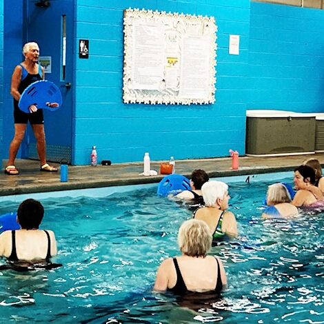 Miami Athletic Club group of adult women attending class at pool