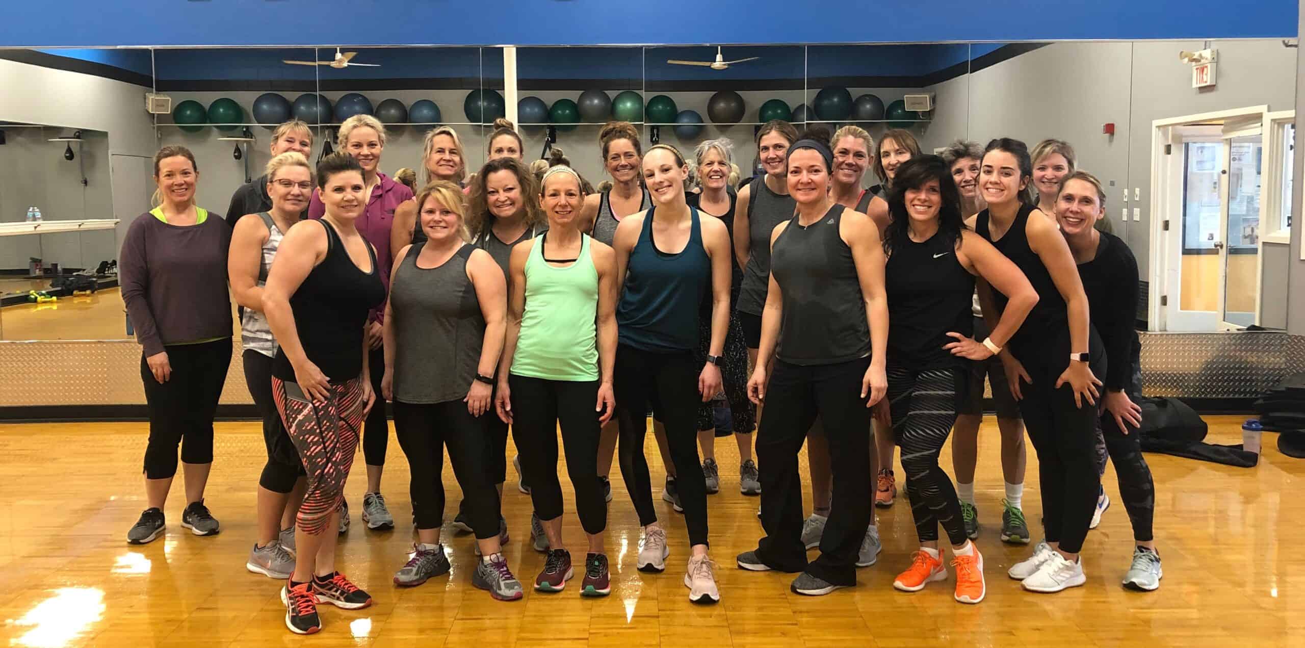 Miami Athletic Club Group Fitness class group of women smiling Miami Athletic Club Group Fitness class group of women smiling